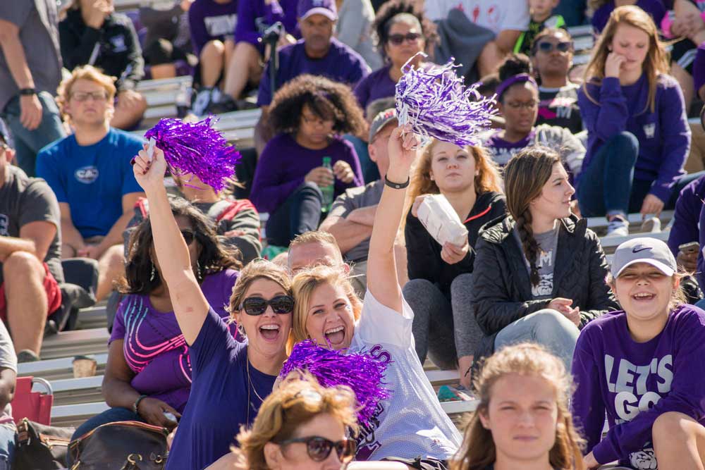 Bulldog fans cheering at a football game in Stokes Stadium