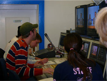 Students working in a newsroom