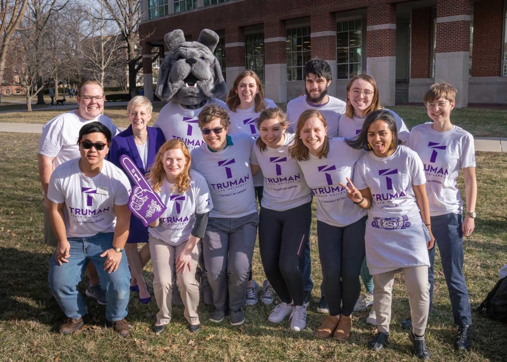 President Sue Thomas with a group of students and the Spike, the Truman mascot