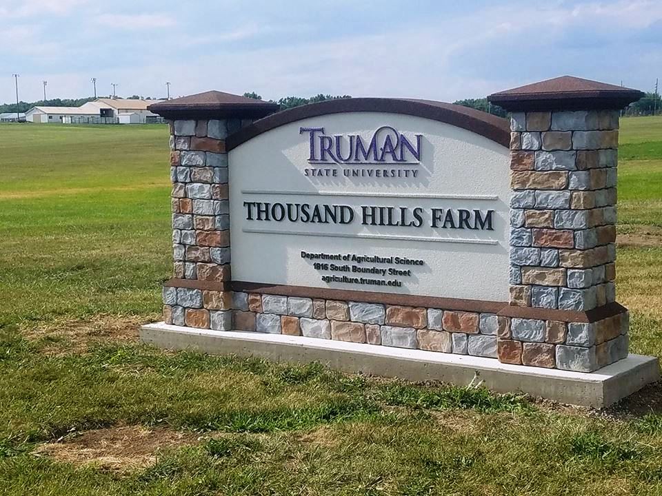 Thousand Hills Farm sign at t he entrance to the Truman State University Farm