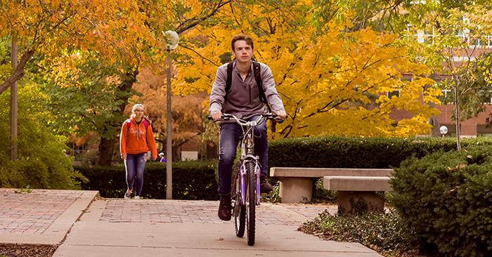 A student riding a bike