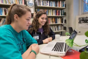 Student helping another student in the Writing Center