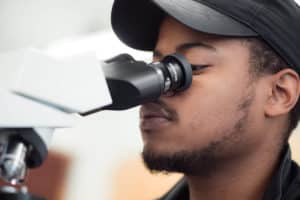 Student using microscope