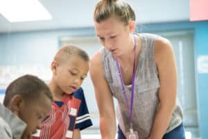 Teacher with students in classroom