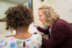 Student clinician working with child in Speech and Hearing Clinic