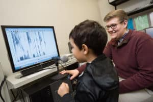 Student clinician working with young child