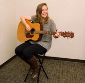 Student playing guitar