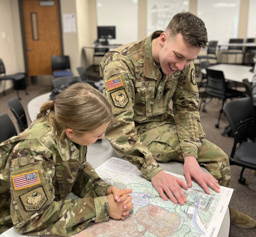 Two CDTs looking at a map
